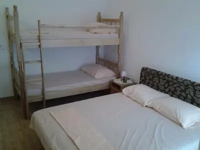 a bedroom with two bunk beds in a room at Vila Almas in Ulcinj