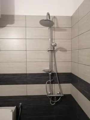 a shower in a bathroom with a glass wall at Vila Almas in Ulcinj