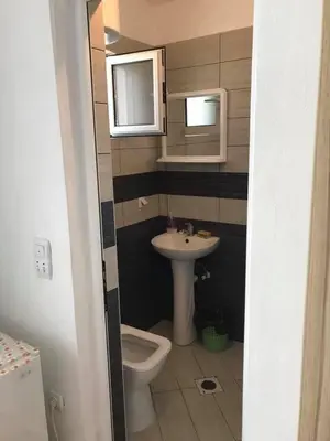 a bathroom with a sink and a toilet at Vila Almas in Ulcinj