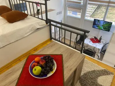 a bowl of fruit on a table in a bedroom at Sutorange in Sutomore