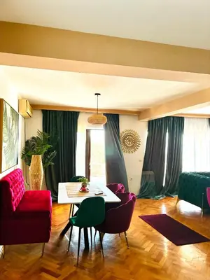 a living room with a table and chairs at Waves View in Ulcinj
