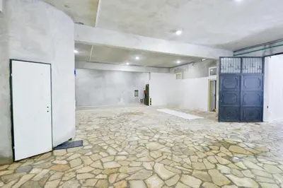 an empty room with a stone floor and a door at Harmonia Hills Apartments in Budva