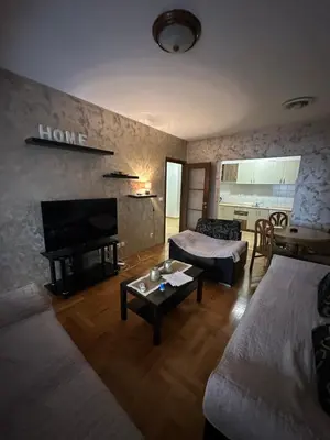 a living room with two beds and a couch at Big apartment 2 in Podgorica