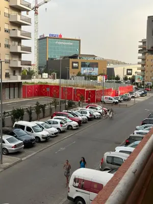 a parking lot with a bunch of parked cars at Big apartment 2 in Podgorica