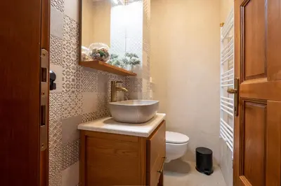 a bathroom with a sink and a toilet at White Hill Villa in Masline
