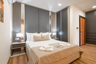 a bedroom with a large bed in a room at Dulamerovic Hotel in Ulcinj