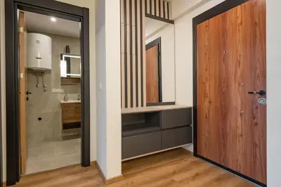 a hallway with a door leading to a kitchen at Dulamerovic Hotel in Ulcinj