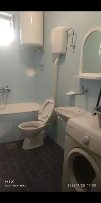 a bathroom with a toilet and a sink at Prestige in Podgorica