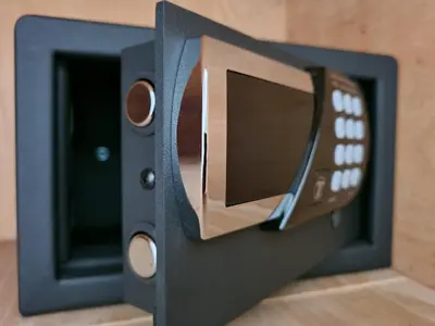a black safe with a remote control in it at Casa Cristiano in Sutomore