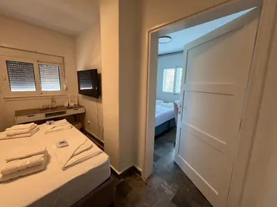 a small room with a door leading to a bedroom at Casa Cristiano in Sutomore