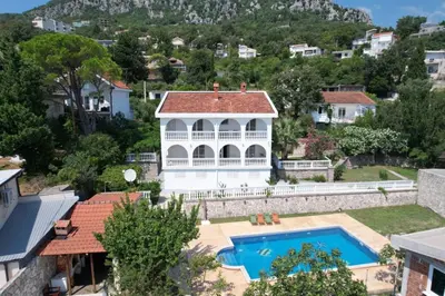 an aerial view of a house with a swimming pool at Sunset Pool Retreat in Zagrađe