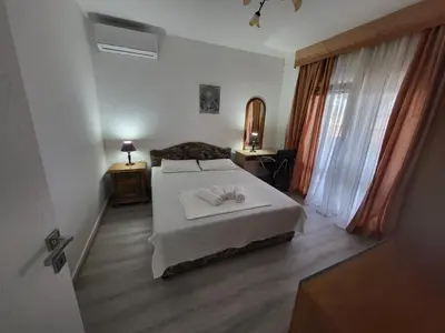 a bedroom with a bed with two towels on it at Sunset Pool Retreat in Zagrađe