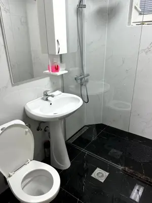 a bathroom with a toilet and a sink and a shower at Sunset Pool Retreat in Zagrađe