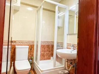 a bathroom with a shower and a toilet and a sink at Apartment Anita - Budva in Budva