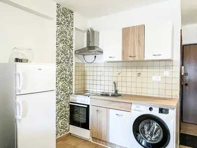 a kitchen with a washing machine and a refrigerator at Apartment Anita - Budva in Budva