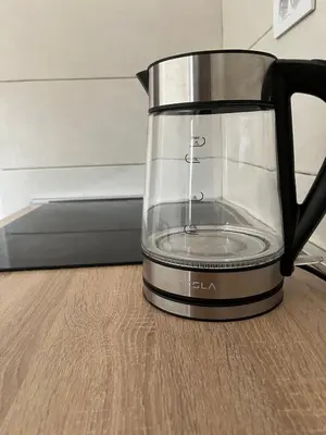 a blender sitting on top of a wooden table at Apartman Podgorica in Podgorica