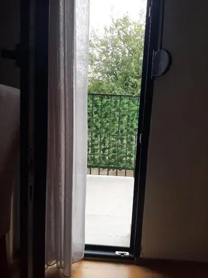 an open door with a view of a balcony at Apartman Podgorica in Podgorica