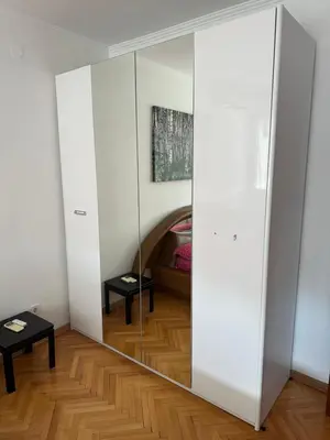 a large mirror in a room with a bed at Large Centre apartment in Podgorica