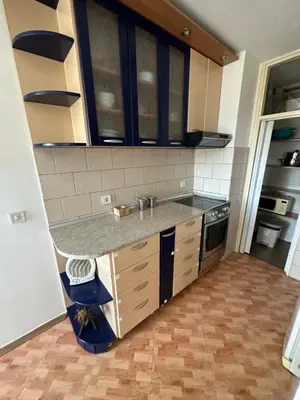 a kitchen with a sink and a counter top at Large Centre apartment in Podgorica
