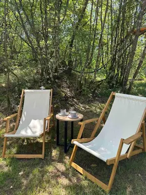 two chairs and a table with cups on it at Vukova dolina apartments in Cetinje