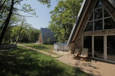 a view of the front of a house with a patio at Vukova dolina apartments in Cetinje