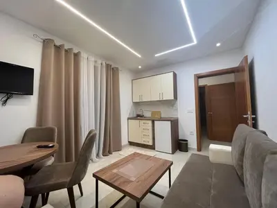a living room with a couch and a table at Arbneshi Apartments in Ulcinj