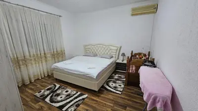 a small bedroom with a bed and a window at Guest house Boljević in Rap