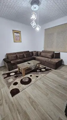 a living room with a couch and a coffee table at Guest house Boljević in Rap