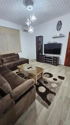 a living room with a couch and a coffee table at Guest house Boljević in Rap