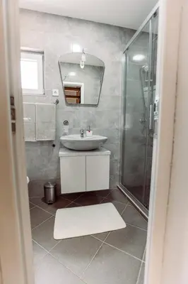 a bathroom with a sink and a shower at Aria in Cetinje