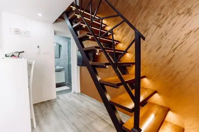 a staircase in a house with wooden floors at Aria in Cetinje