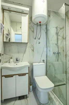 a bathroom with a toilet and a sink and a shower at Villa Lux Rajović in Budva