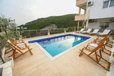 a swimming pool on the roof of a house at Villa Lux Rajović in Budva