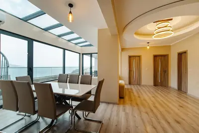 an office meeting room with a table and chairs at Budva Gate Penthouse in Budva