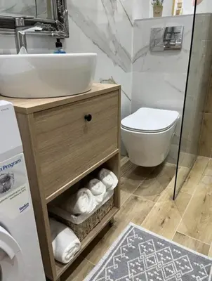 a bathroom with a sink and a toilet at Apartment Quince in Budva
