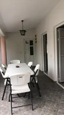 a white table and chairs in a room at Sea in Ulcinj