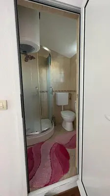 a bathroom with a shower and a toilet in it at Sea in Ulcinj