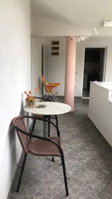 a table and a chair in a room at Sea in Ulcinj