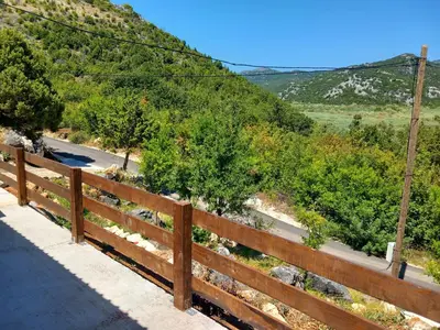a fence on the side of a road at LAKE VIEW PREVLAKA in Cetinje