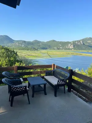 a group of benches with a view of the water at LAKE VIEW PREVLAKA in Cetinje