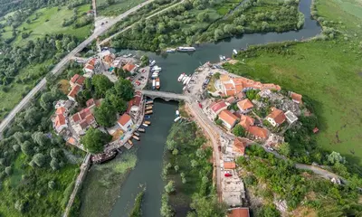 an aerial view of a village on a river at Superb Apartments Virpazar in Virpazar