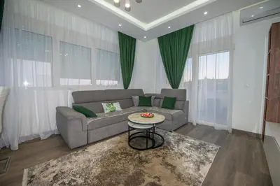 a living room with a couch and a table at Apartment Lara in Ulcinj