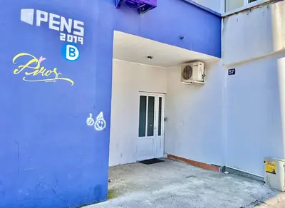 a blue wall of a building with a door at Homestay Mark - DOUBLE BED ROOM - shared bathroom in Budva