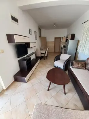 a living room with a couch and a table at Apartmani Vujovic Markovici in Budva