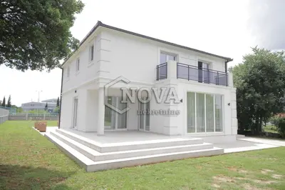 a white house with the word nova on it at Vila Mikeli in Podgorica