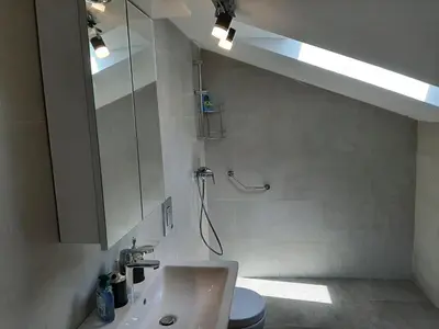 a bathroom with a sink and a shower and a toilet at Beautiful flat with sea view Aquamarine in Kotor