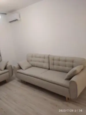 a living room with a couch and a chair at Apartments Exclusive in Ulcinj