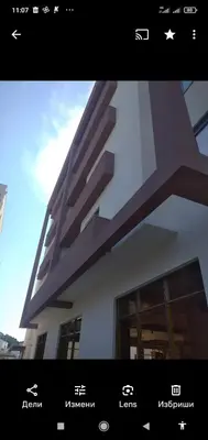 a screen shot of a building with a picture of it at Apartments Exclusive in Ulcinj