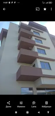 a poster of a building with a picture of it at Apartments Exclusive in Ulcinj