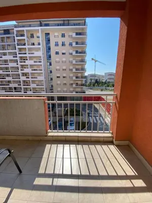 a balcony with a view of a large building at Danilo's apartment in Podgorica